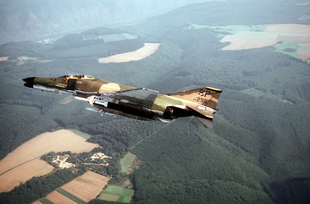 low-angle-left-side-view-of-an-f-4g-phantom-ii-aircraft-banking-to-the-right-b6c001-1600.jpg